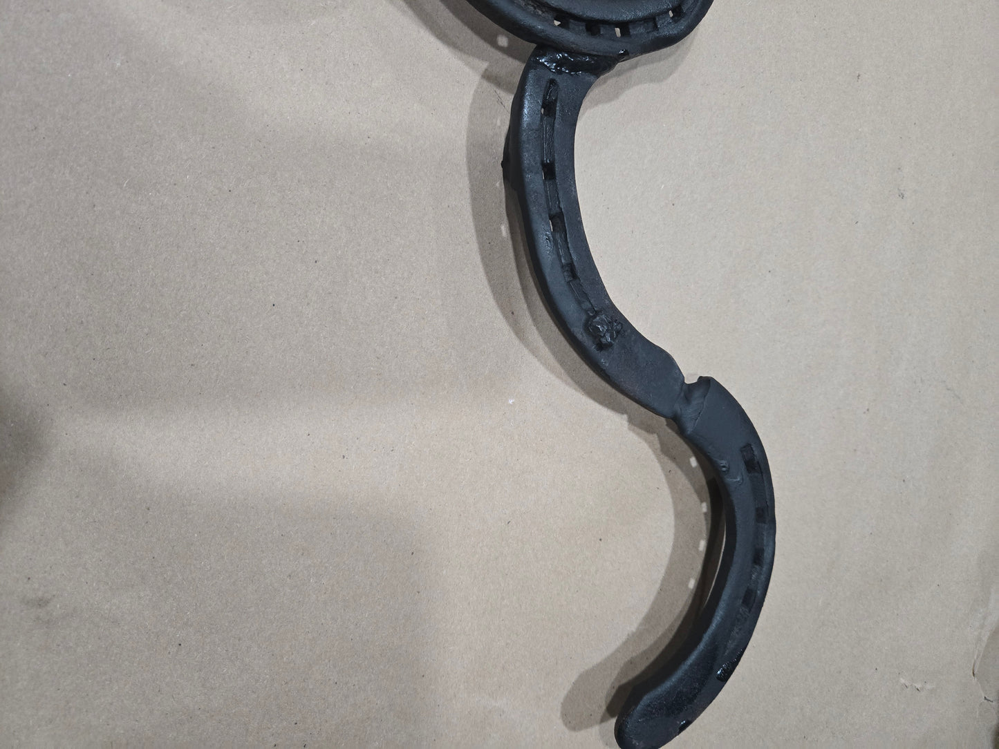 Authentic horseshoes repurposed into a Longhorn wall hanging - Mat Black and Original Rustic finish available.