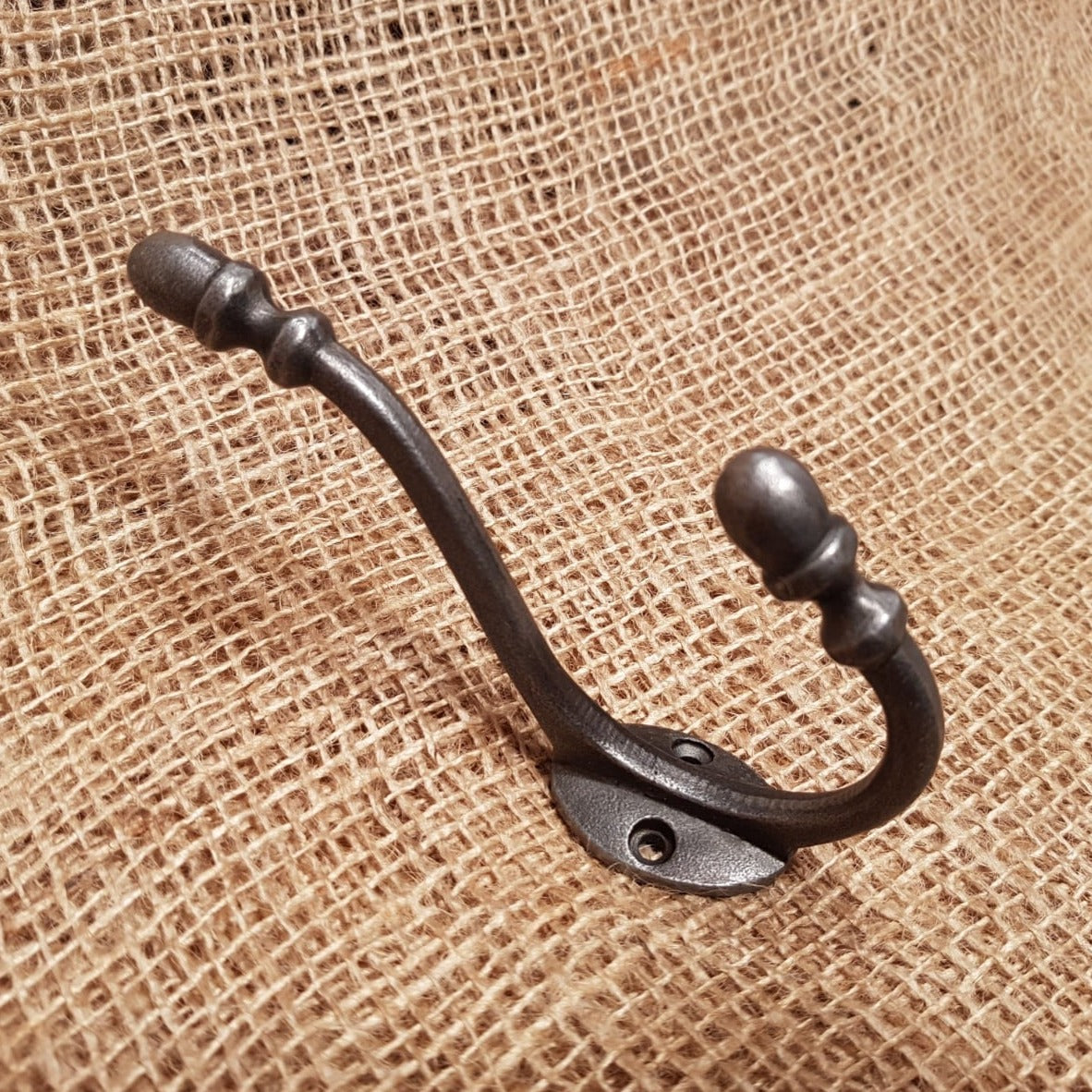 https://www.thespearheadcollection.com/cdn/shop/products/acorn-tipped-hat-coat-hook1-min.jpg?v=1647357599&width=1445